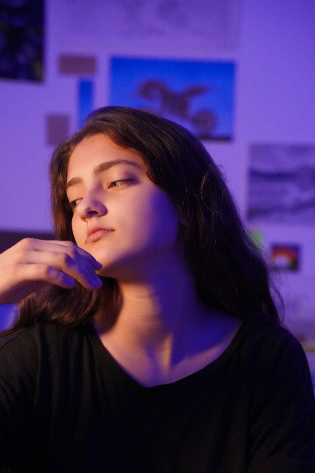 Thoughtful young woman portrait with soft blue lighting
